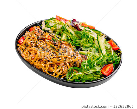 Tasty noodles served with fresh salad in a black tray at a casual dining setting Tasty noodles served with fresh salad in a black tray at a casual dining setting 122632965