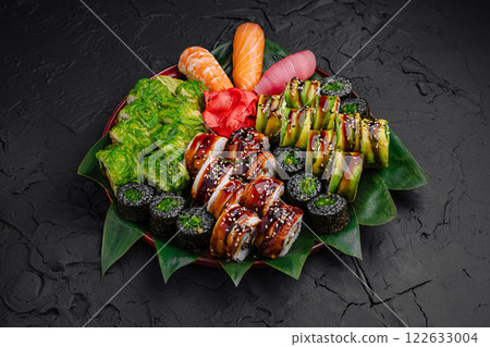 Fresh sushi assortment served on a traditional platter with vibrant colors and varied textures Fresh sushi assortment served on a traditional platter with vibrant colors and varied textures 122633004