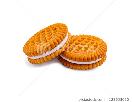 Delicious orange cream-filled cookies stacked on a bright background for a sweet dessert treat 122633050
