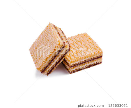 Delicious layered cakes are stacked together, showcasing alternating flavors and textures in a tempting dessert display Delicious layered cakes are stacked together, showcasing alternating flavors and textures in a tempting dessert display 122633051