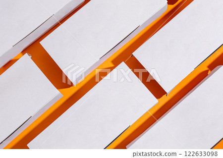 white cardboard food boxes for delivery on a yellow background white cardboard food boxes for delivery on a yellow background 122633098