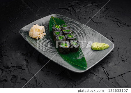 Freshly prepared vegetarian sushi rolls served on a decorative plate with wasabi and pickled ginger Freshly prepared vegetarian sushi rolls served on a decorative plate with wasabi and pickled ginger 122633107
