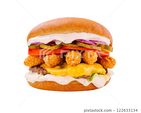 Delicious cheeseburger stacked with crispy toppings and fresh vegetables enjoyed at a casual dining location 122633134