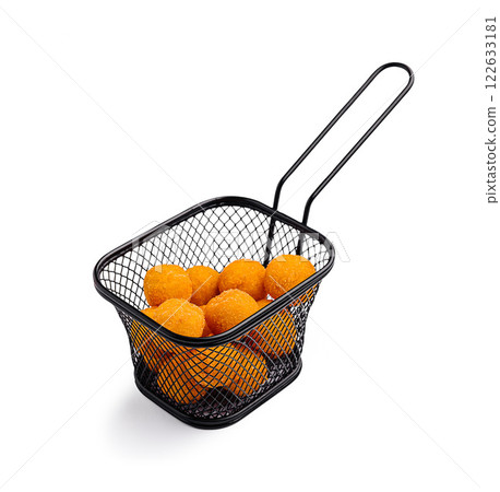 Crispy golden cheese balls in a small black wire basket ready for serving at a snack bar or party 122633181