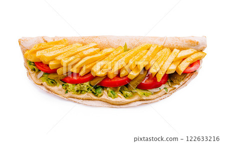 Delicious wrap filled with fries, fresh vegetables, and savory sauce served on a white background Delicious wrap filled with fries, fresh vegetables, and savory sauce served on a white background 122633216
