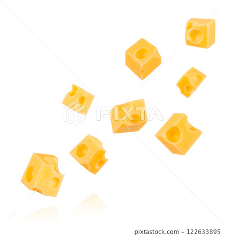 Pieces of cheese flying. Cheese cubes with holes levitating in air isolated on white background 122633895