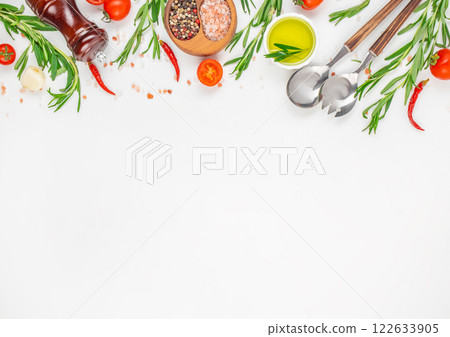 fresh herbs, spices and kitchen utensils on a white background. Cooking table. top view. copy space 122633905
