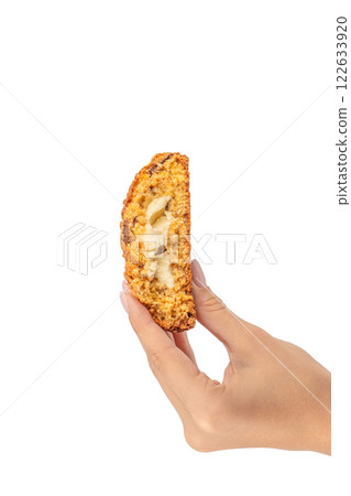 Oatmeal cookies in hand isolated on white background 122633920