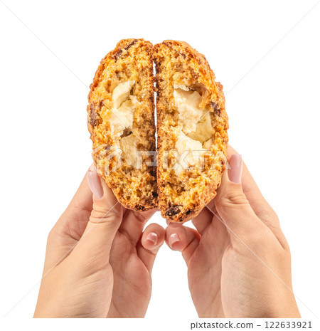 Women hands holding homemade cookie biscuits with filling isolated white background Women hands holding homemade cookie biscuits with filling isolated white background 122633921