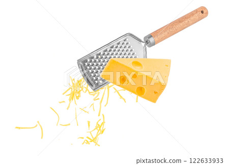 Piece of cheese is rubbed on a hand grater isolated on white 122633933