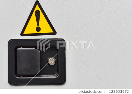 Metal doors with a lock, electric shock hazard sign zone Metal doors with a lock, electric shock hazard sign zone 122633972