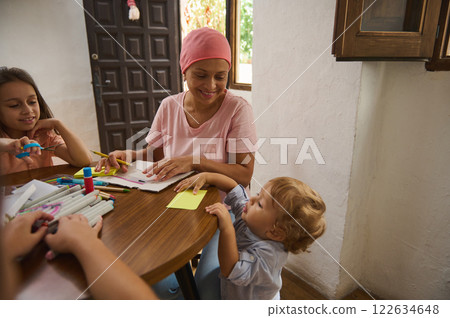 Family bonding over crafts and creativity during a joyful afternoon at home 122634648