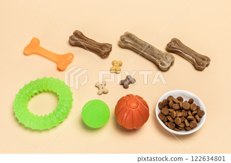 Pet supplies and playful items including a toy and dry food for dogs. Pet supplies and playful items including a toy and dry food for dogs. 122634801
