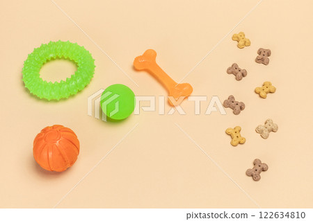 Pet supplies and playful items including a toy and dry food for dogs. 122634810