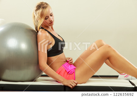 woman doing fitness exercises with fit ball 122635692