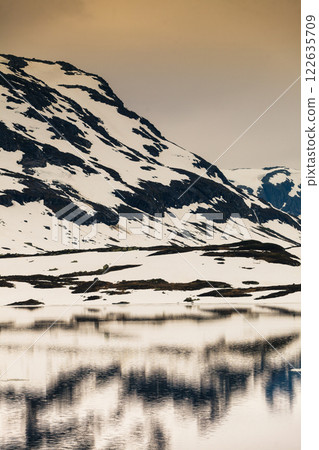 Norway scenic mountains with frozen lake. Norway scenic mountains with frozen lake. 122635709