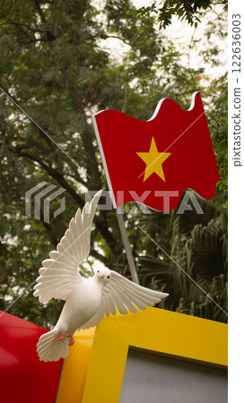 Hanoi, Hoan Kiem Lake area, Vietnamese flag and dove monument, May 2024 Hanoi, Hoan Kiem Lake area, Vietnamese flag and dove monument, May 2024 122636003