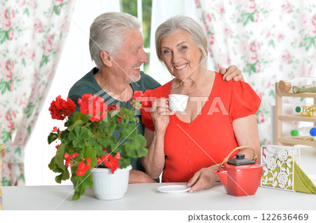Portrait of senior couple drinking coffee at home 122636469