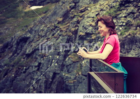 Tourist woman on Trollstigen viewpoint in Norway 122636734