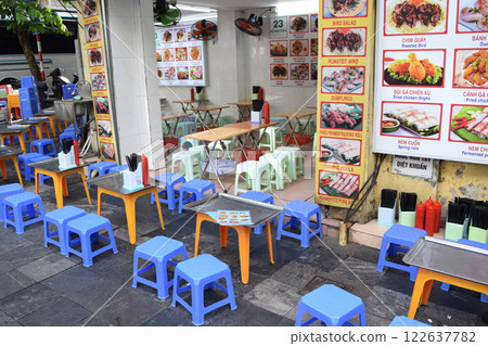 Vietnam: Dining hall with tables and chairs extended to the outdoors Vietnam: Dining hall with tables and chairs extended to the outdoors 122637782