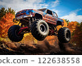 Monster Truck driving off-road outdoors 122638558