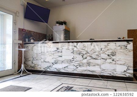 Budget hotel lobby, visitor reception desk 122638592