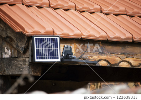 Small solar panel powering a LED yard light Small solar panel powering a LED yard light 122639315