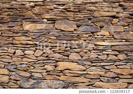 Stone background - horizontally arranged naturally quarried stones 122639317