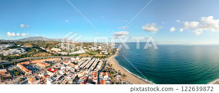 Panoramic aerial view of La Cala de Mijas showcasing sandy beaches, residential areas, and the 122639872