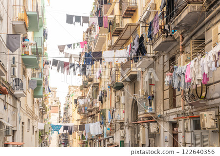 Naples, Italy: Laundry lines strung between buildings. Naples, Italy: Laundry lines strung between buildings. 122640356