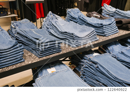 Neatly stacked blue jeans display in clothing store. Last-Minute Shopper's Day Neatly stacked blue jeans display in clothing store. Last-Minute Shopper's Day 122640922