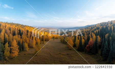 Breathtaking Panoramic View of Autumn Foliage in Mountainous Landscape at Sunrise 122641550
