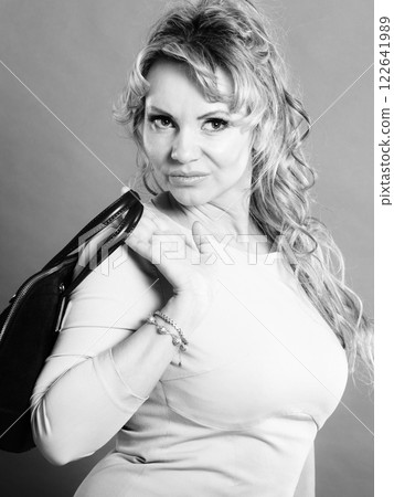 Portrait of mid aged fashionable woman. Portrait of mid aged fashionable woman. 122641989