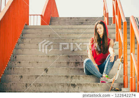 Skate girl on stairs with skateboard. 122642274