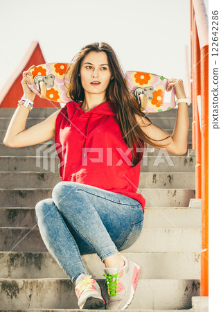 Skate girl on stairs with skateboard. Skate girl on stairs with skateboard. 122642286