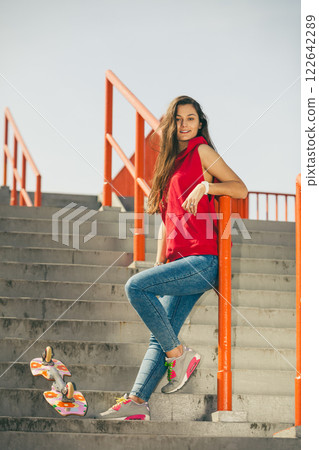 Urban skate girl with skateboard. 122642289