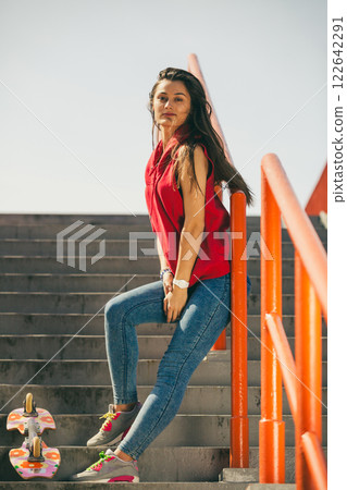 Urban skate girl with skateboard. 122642291