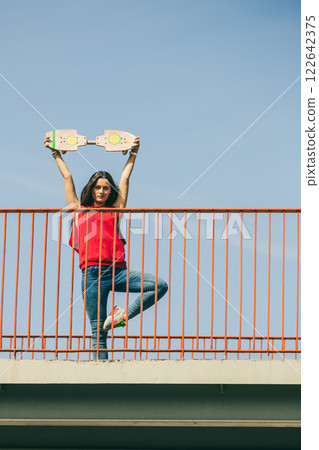 Urban skate girl with skateboard. Urban skate girl with skateboard. 122642375