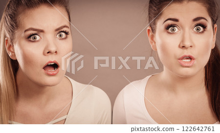 Two shocked and amazed women 122642761