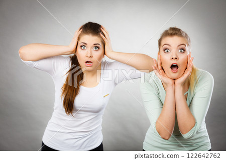 Two shocked and amazed women 122642762