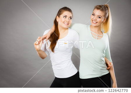 Two happy women friends having fun 122642770
