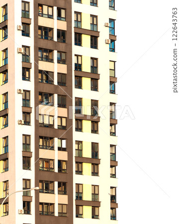 Modern high-rise residential building with sleek facades and balconies, contemporary condominium 122643763
