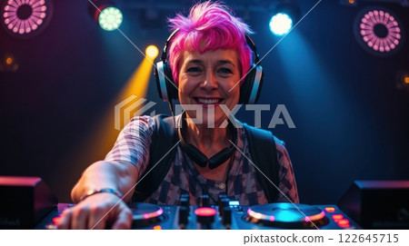 old modern woman behind a DJ booth 122645715