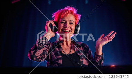 old modern woman behind a DJ booth 122645745