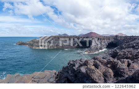 Rugged Coastal Landscape with Volcanic Rock Formations 122645962