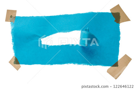Torn blue paper with adhesive tape 122646122