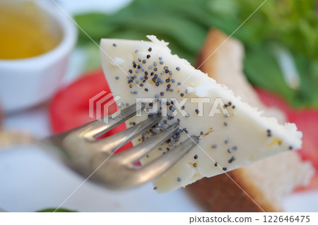 Enjoy a Delicious Cheese Slice Served on Soft Bread with Fresh Ingredients Enjoy a Delicious Cheese Slice Served on Soft Bread with Fresh Ingredients 122646475