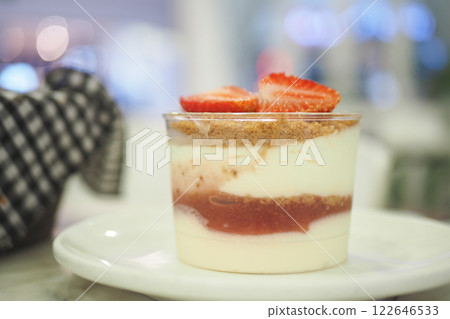 A Delicious and Beautiful Layered Strawberry Dessert Served in a Glass 122646533
