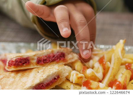 child eating french fries close up child eating french fries close up 122646674