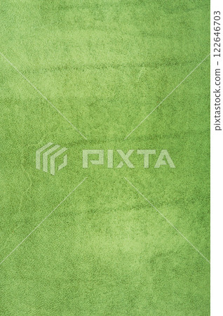 Green suede background vertical photo. Natural suede leather dyed green. 122646703